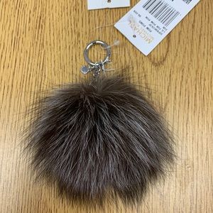 Michael Kors Large fluff ball. Grey with white ends and silver hardware.